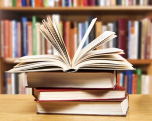 A pile of books with library on the back